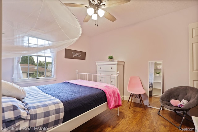 622 W Schleier St, Frankenmuth, MI 48734 - bedroom with wood finished floors, lofted ceiling, and ceiling fan
