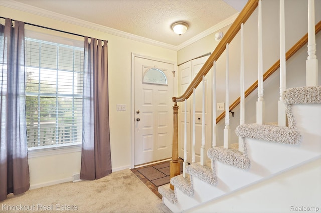622 W Schleier St, Frankenmuth, MI 48734 - entryway featuring stairs, crown molding, carpet flooring, and a textured ceiling