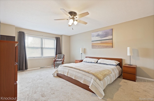 622 W Schleier St, Frankenmuth, MI 48734 - carpeted bedroom featuring baseboards and ceiling fan
