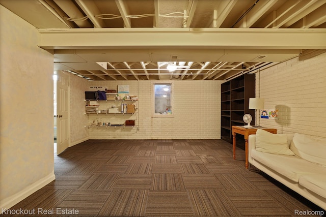 622 W Schleier St, Frankenmuth, MI 48734 - unfinished basement with brick wall and dark colored carpet