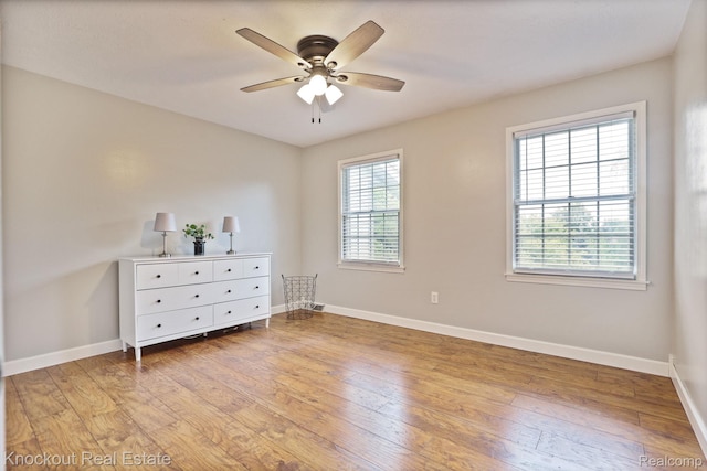 622 W Schleier St, Frankenmuth, MI 48734 - unfurnished room with a ceiling fan and light wood-style floors