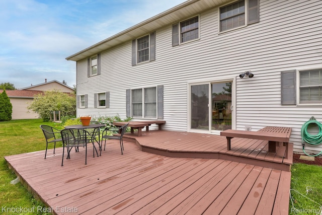 622 W Schleier St, Frankenmuth, MI 48734 - wooden deck featuring outdoor dining area and a yard