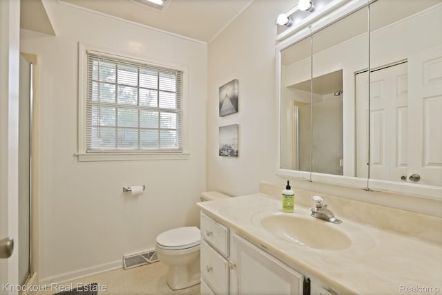 622 W Schleier St, Frankenmuth, MI 48734 - bathroom featuring a shower with door, vanity, ornamental molding, and tile patterned floors