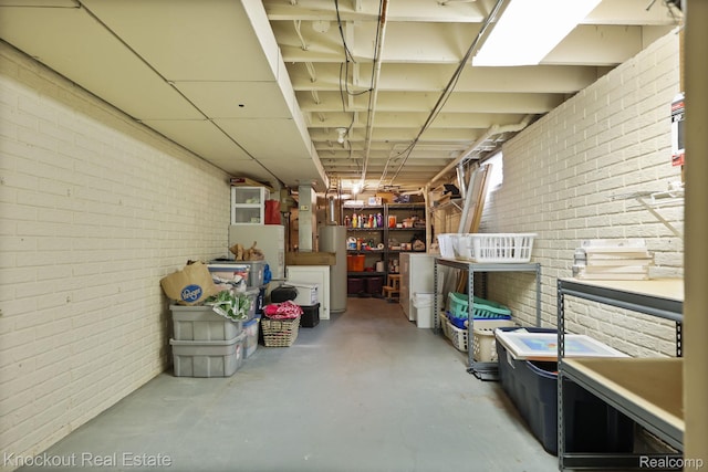 622 W Schleier St, Frankenmuth, MI 48734 - unfinished basement featuring brick wall and water heater