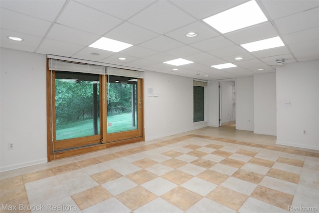 5844 Independence Ln, West Bloomfield, MI 48322 - empty room with a paneled ceiling and baseboards