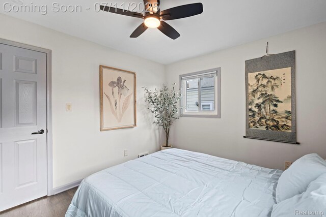 24528 Schroeder Ave, Eastpointe, MI 48021 - bedroom featuring dark wood-style floors and a ceiling fan
