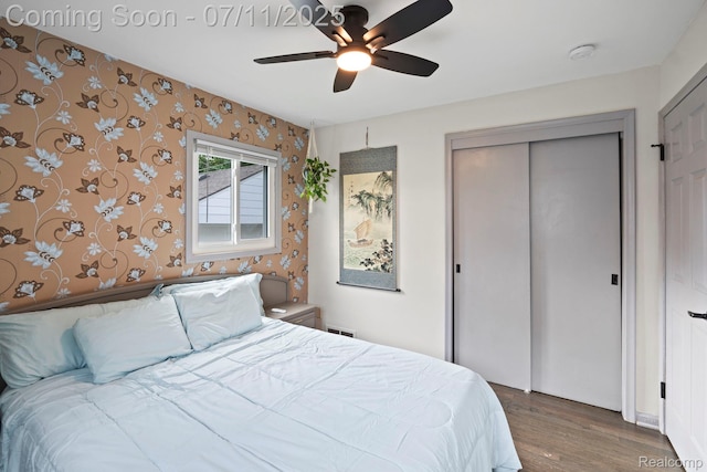 24528 Schroeder Ave, Eastpointe, MI 48021 - bedroom featuring wallpapered walls, wood finished floors, a closet, and a ceiling fan