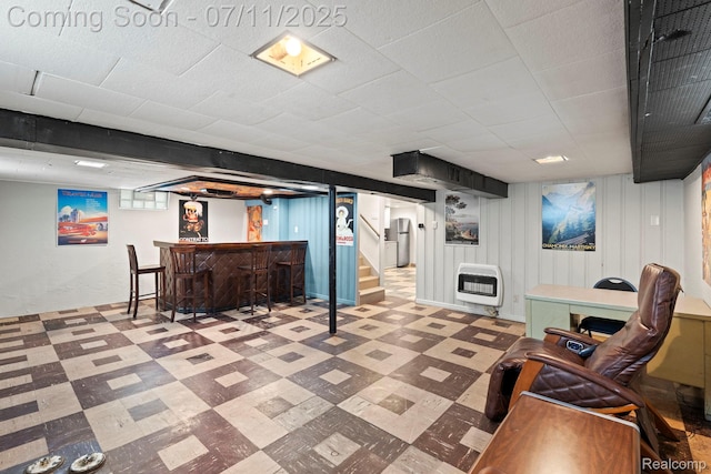 24528 Schroeder Ave, Eastpointe, MI 48021 - finished below grade area featuring heating unit, tile patterned floors, a dry bar, and stairs