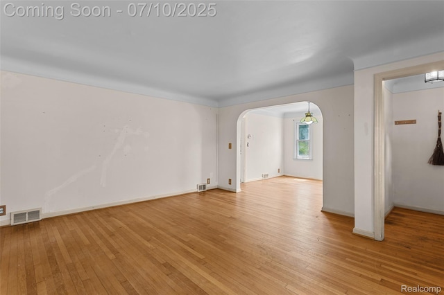 18930 Deering St, Melvindale, MI 48152 - spare room with arched walkways and light wood-style floors