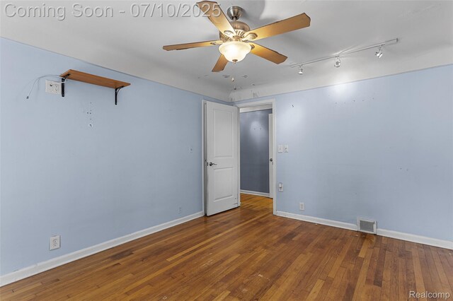 18930 Deering St, Melvindale, MI 48152 - unfurnished room with a ceiling fan, rail lighting, and hardwood / wood-style flooring