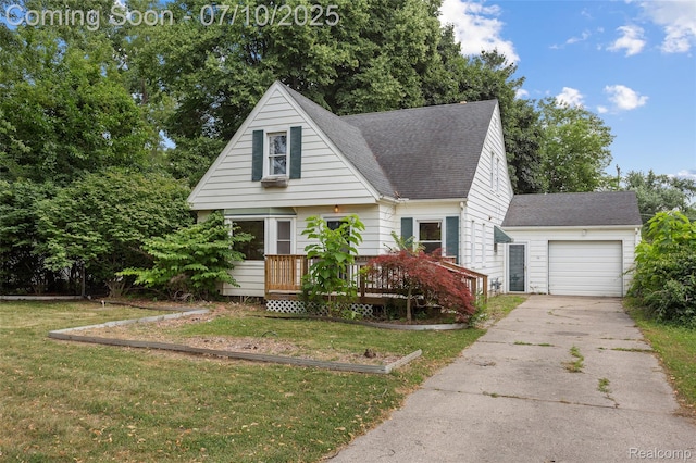 18930 Deering St, Melvindale, MI 48152 - view of front facade featuring concrete driveway, a front lawn, a shingled roof, a deck, and a garage