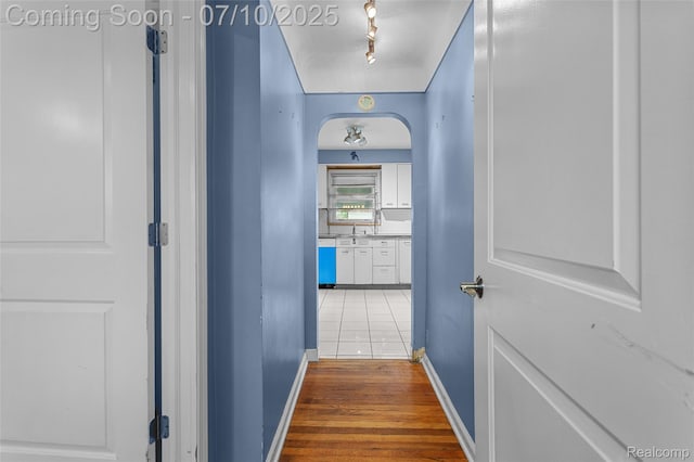 18930 Deering St, Melvindale, MI 48152 - hall with rail lighting and light wood-style flooring