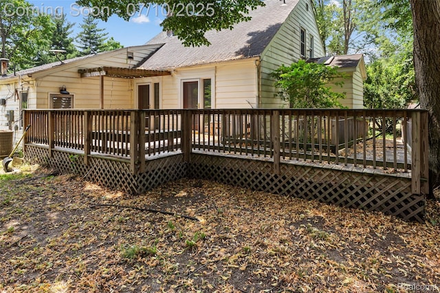 18930 Deering St, Melvindale, MI 48152 - back of property with roof with shingles and a wooden deck