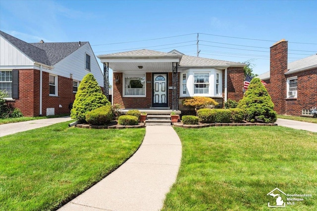 1508 12th St, Wyandotte, MI 48192 - bungalow-style house with brick siding and a front lawn