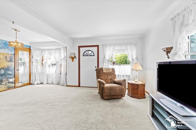 1508 12th St, Wyandotte, MI 48192 - carpeted living room with a chandelier