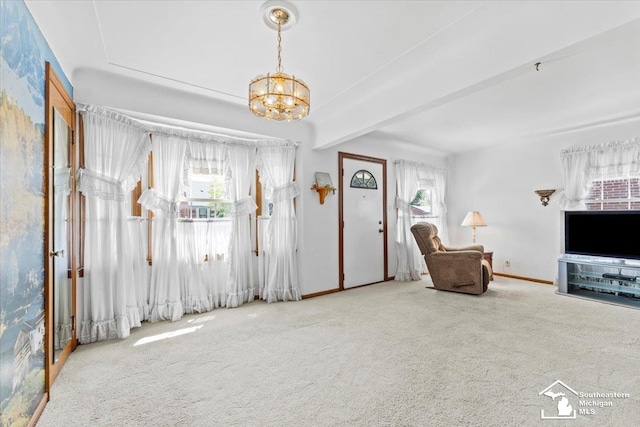 1508 12th St, Wyandotte, MI 48192 - living area with carpet flooring and a chandelier