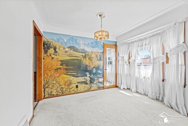 1508 12th St, Wyandotte, MI 48192 - carpeted spare room with a chandelier