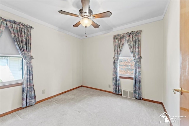 1508 12th St, Wyandotte, MI 48192 - carpeted empty room with ceiling fan and ornamental molding