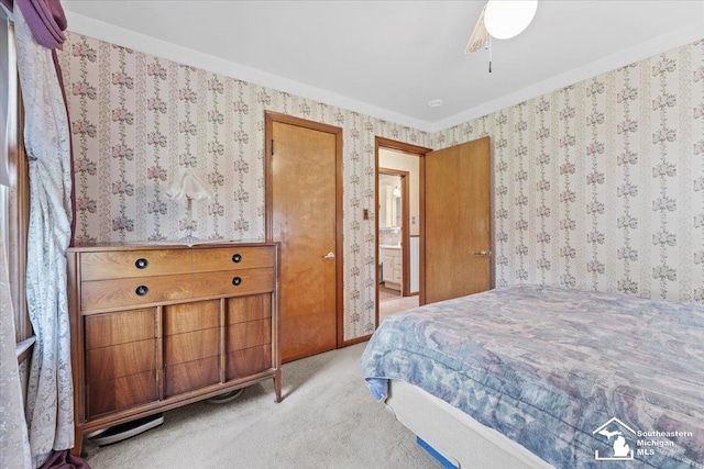 1508 12th St, Wyandotte, MI 48192 - bedroom featuring light carpet, wallpapered walls, and ceiling fan