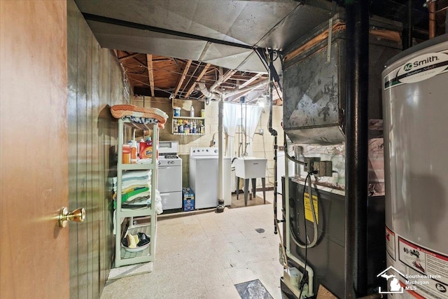 1508 12th St, Wyandotte, MI 48192 - unfinished below grade area with washer and clothes dryer, water heater, and tile patterned floors