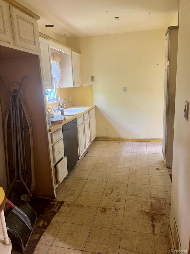 638 W Pulaski Ave, Flint, MI 48505 - kitchen featuring black dishwasher, light countertops, and light flooring