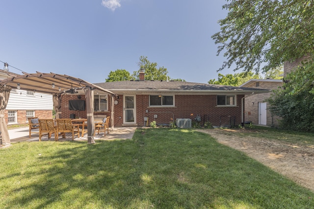 2041 Norfolk Ave, Ann Arbor, MI 48103 - rear view of house featuring a pergola, a lawn, brick siding, and a patio area