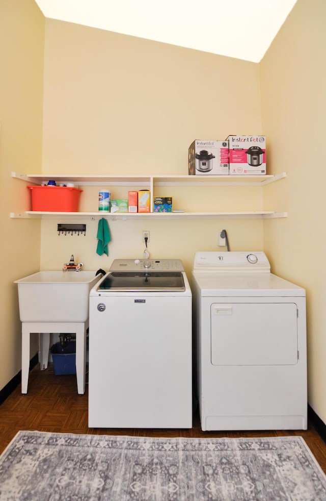 609 Watersedge Dr, Ann Arbor, MI 48105 - laundry room with washing machine and dryer and baseboards