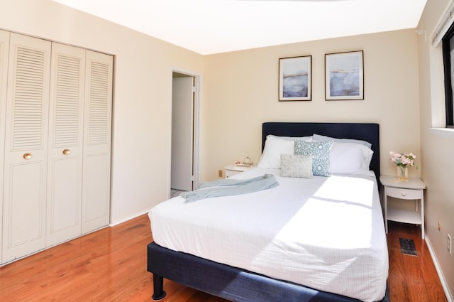 609 Watersedge Dr, Ann Arbor, MI 48105 - bedroom with light wood-type flooring and a closet