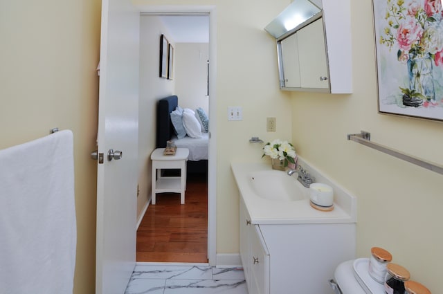 609 Watersedge Dr, Ann Arbor, MI 48105 - half bath with vanity and marble look tiles