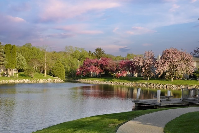 609 Watersedge Dr, Ann Arbor, MI 48105 - view of community featuring a water view, a lawn, and a dock