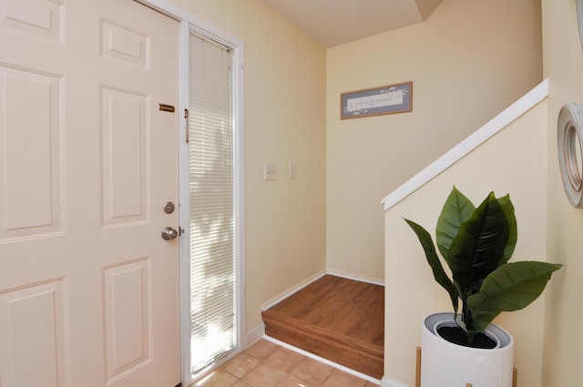609 Watersedge Dr, Ann Arbor, MI 48105 - entrance foyer with light tile patterned floors and baseboards