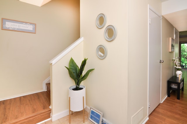 609 Watersedge Dr, Ann Arbor, MI 48105 - stairs with wood finished floors and baseboards