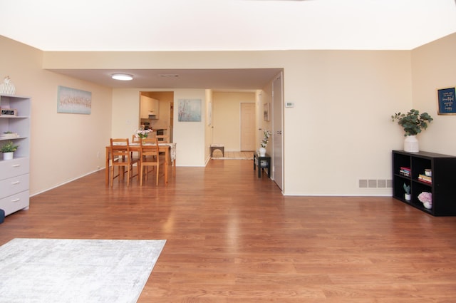 609 Watersedge Dr, Ann Arbor, MI 48105 - dining space with light wood-style flooring and baseboards