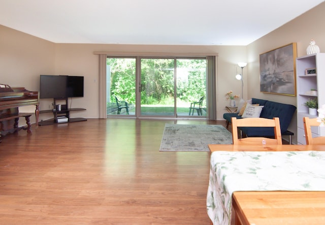 609 Watersedge Dr, Ann Arbor, MI 48105 - bedroom featuring multiple windows, wood finished floors, and access to outside