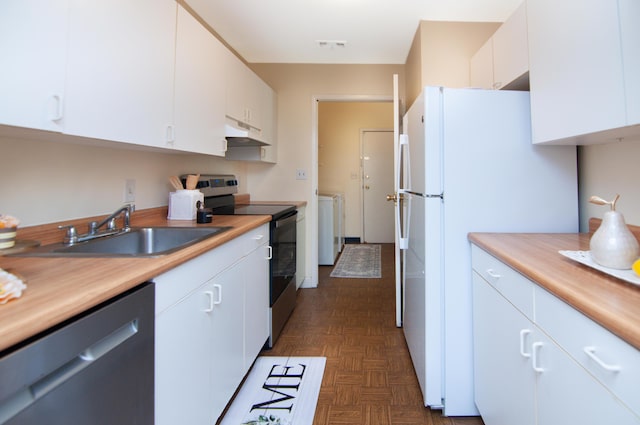 609 Watersedge Dr, Ann Arbor, MI 48105 - kitchen with stainless steel appliances, under cabinet range hood, separate washer and dryer, white cabinetry, and light countertops