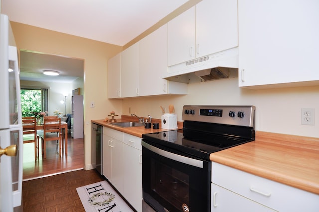609 Watersedge Dr, Ann Arbor, MI 48105 - kitchen with stainless steel appliances, under cabinet range hood, light countertops, and white cabinets