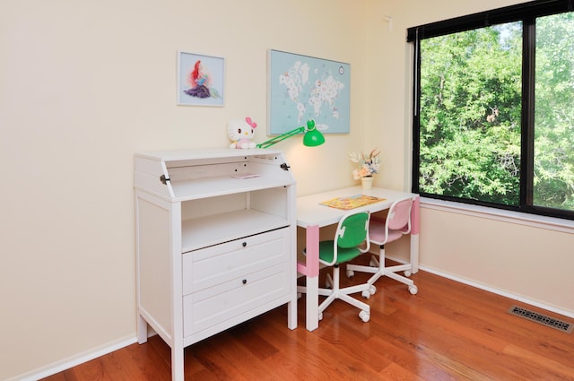 609 Watersedge Dr, Ann Arbor, MI 48105 - home office with baseboards and wood finished floors
