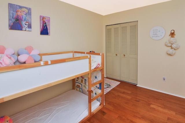 609 Watersedge Dr, Ann Arbor, MI 48105 - bedroom featuring wood finished floors and a closet