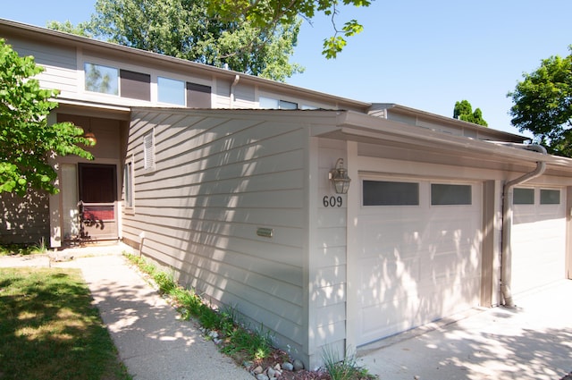 609 Watersedge Dr, Ann Arbor, MI 48105 - garage featuring driveway