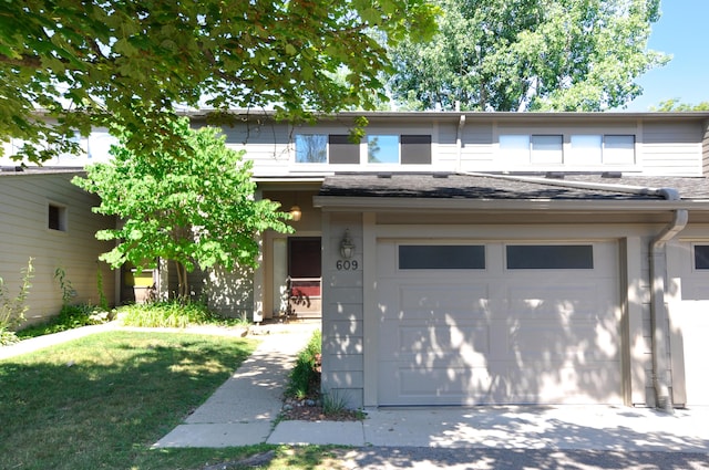 609 Watersedge Dr, Ann Arbor, MI 48105 - view of front of property with concrete driveway and roof with shingles