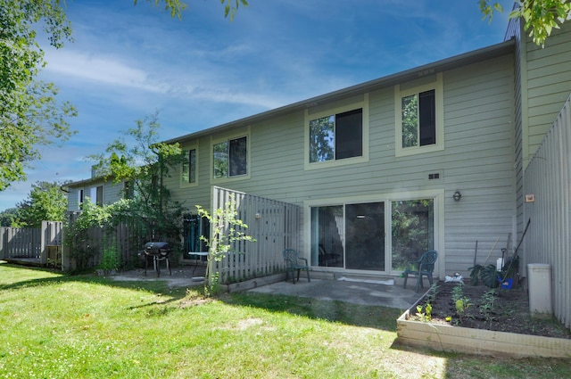 609 Watersedge Dr, Ann Arbor, MI 48105 - rear view of house featuring a lawn and a patio