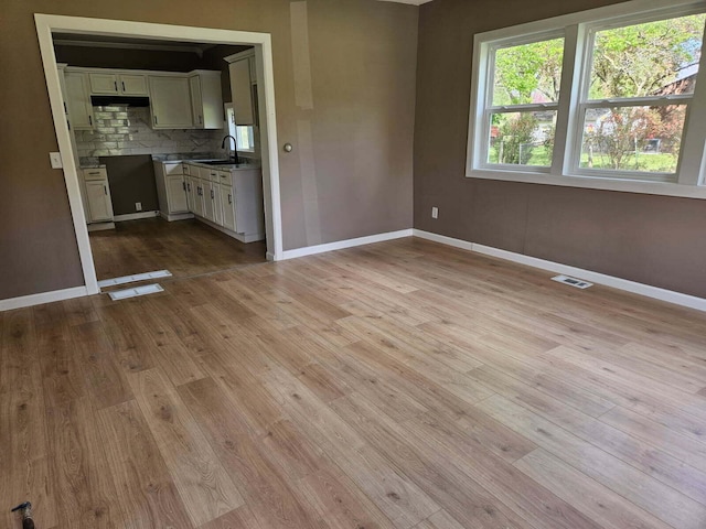4084 Seneca St, Weston, MI 49289 - unfurnished living room with wood finished floors