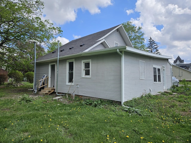4084 Seneca St, Weston, MI 49289 - view of side of home with entry steps and a lawn