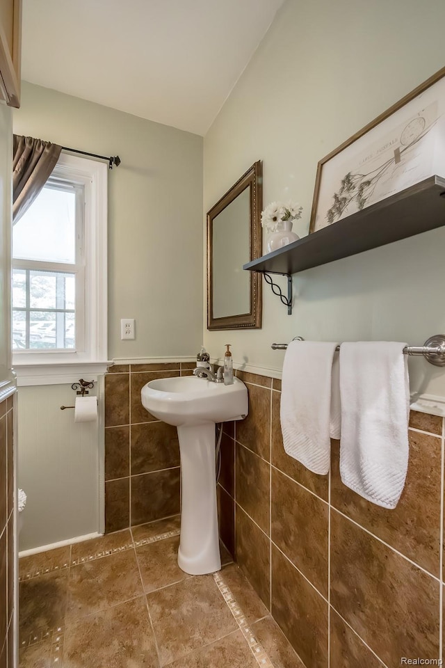 3070 Old Orchard Dr, Waterford, MI 48328 - bathroom with a wainscoted wall, tile walls, and tile patterned flooring