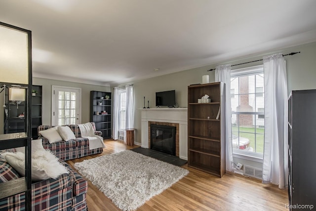 3070 Old Orchard Dr, Waterford, MI 48328 - living room with a fireplace and light wood finished floors