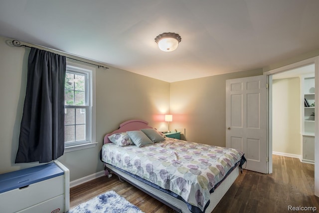 3070 Old Orchard Dr, Waterford, MI 48328 - bedroom with dark wood-style floors and baseboards
