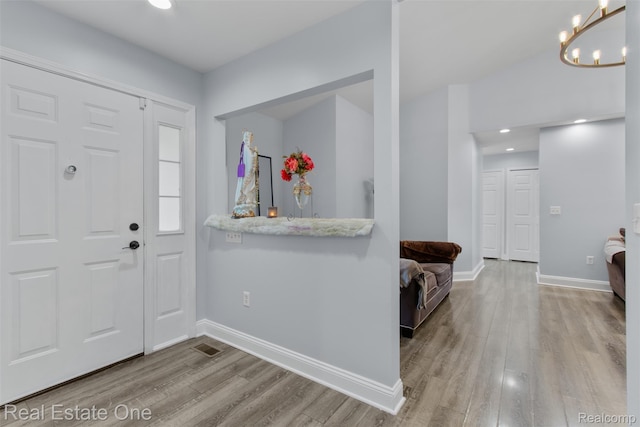 2930 Wisconsin Rd, Troy, MI 48083 - entryway featuring wood finished floors, recessed lighting, and a chandelier