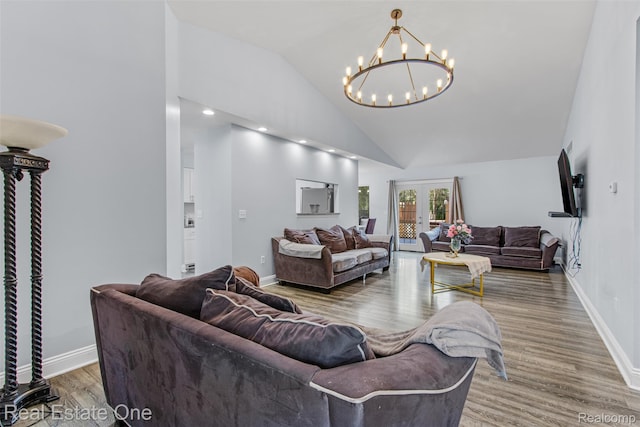 2930 Wisconsin Rd, Troy, MI 48083 - living room featuring high vaulted ceiling, a chandelier, and wood finished floors