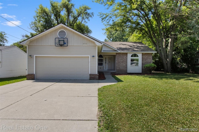 2930 Wisconsin Rd, Troy, MI 48083 - ranch-style house with brick siding, an attached garage, concrete driveway, and a front lawn