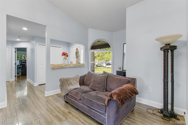 2930 Wisconsin Rd, Troy, MI 48083 - living area with wood finished floors, recessed lighting, and arched walkways